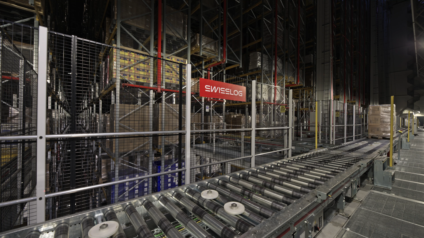 Automated warehouse with Swisslog conveyor system and pallet racks